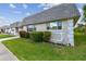 Charming home with a well-maintained lawn, fresh landscaping, and a gray roof at 8447 Orleans N, Pinellas Park, FL 33781