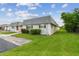 Charming single-story home with green lawn, flower beds, and large windows, offering cozy curb appeal at 8447 Orleans N, Pinellas Park, FL 33781