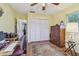 A comfortable home office with hardwood floors and a large closet at 8447 Orleans N, Pinellas Park, FL 33781
