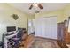 A comfortable home office with hardwood floors and a large closet at 8447 Orleans N, Pinellas Park, FL 33781