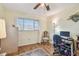 A comfortable home office featuring hardwood floors and large windows at 8447 Orleans N, Pinellas Park, FL 33781