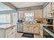 Bright kitchen featuring a center island and modern appliances at 8447 Orleans N, Pinellas Park, FL 33781