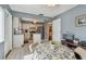 Kitchen area includes white cabinets, stainless steel refrigerator, and a breakfast table at 8447 Orleans N, Pinellas Park, FL 33781