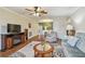 Inviting living room featuring a ceiling fan and wood flooring at 8447 Orleans N, Pinellas Park, FL 33781