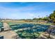 Outdoor shuffleboard court is shown with an area of benches and additional neighborhood amentities at 8447 Orleans N, Pinellas Park, FL 33781