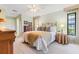 Serene bedroom featuring soft natural light, a queen bed, and elegant decor at 8515 Macoma Ne Dr, St Petersburg, FL 33702