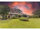 A beautiful home with lush landscaping and a serene screened-in patio, perfect for outdoor living at 8515 Macoma Ne Dr, St Petersburg, FL 33702