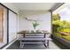 Outdoor dining table on the lanai, great for meals with a beautiful garden and pond view at 8515 Macoma Ne Dr, St Petersburg, FL 33702