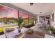 Inviting screened-in lanai featuring a dining table with peaceful waterfront views at 8515 Macoma Ne Dr, St Petersburg, FL 33702