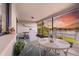 Relaxing outdoor seating area with a view of the landscaped backyard and pond at 8515 Macoma Ne Dr, St Petersburg, FL 33702