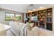 Cozy living room with built-in shelving and desk area providing ample storage and workspace at 8515 Macoma Ne Dr, St Petersburg, FL 33702