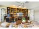 Comfortable living room featuring custom built-ins that offer ample storage and stylish display space at 8515 Macoma Ne Dr, St Petersburg, FL 33702