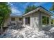 Backyard patio set with bistro lights on a sunny day, perfect for outdoor dining and relaxation at 8701 Driftwood Drive Dr, Tampa, FL 33615