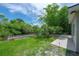 This backyard features a private dock with easy water access and a tranquil outdoor space at 8701 Driftwood Drive Dr, Tampa, FL 33615