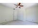 Bedroom with ceiling fan and a built-in closet, offering ample storage space at 8701 Driftwood Drive Dr, Tampa, FL 33615