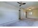 Well-lit bedroom with ceiling fan and a view of connecting rooms through doorway at 8701 Driftwood Drive Dr, Tampa, FL 33615