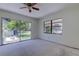 Bedroom with sliding glass doors, offering a bright and airy feel with outdoor access at 8701 Driftwood Drive Dr, Tampa, FL 33615