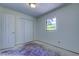 Bright bedroom with closet space and natural light streaming through the window at 8701 Driftwood Drive Dr, Tampa, FL 33615