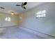 Spacious bedroom featuring a ceiling fan and multiple windows for ample natural light at 8701 Driftwood Drive Dr, Tampa, FL 33615