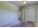 Bedroom with a closet space and doorway, ready for new flooring and personalization at 8701 Driftwood Drive Dr, Tampa, FL 33615