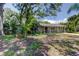 Charming single-story home with well-kept lawn and mature trees at 8701 Driftwood Drive Dr, Tampa, FL 33615