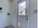 Laundry room featuring convenient exterior access, updated electrical, and water hookups at 8701 Driftwood Drive Dr, Tampa, FL 33615
