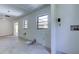 Bright laundry room with new wood-look flooring and modern updates throughout at 8701 Driftwood Drive Dr, Tampa, FL 33615