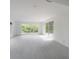 Bright living room with tile floors, large windows and sliding glass doors at 8701 Driftwood Drive Dr, Tampa, FL 33615