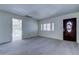 Open living room showcasing tile floors, ample natural light, and an entryway to a sunroom at 8701 Driftwood Drive Dr, Tampa, FL 33615