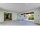 Open-concept living space with large windows and freshly painted walls at 8701 Driftwood Drive Dr, Tampa, FL 33615