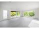 Bright living room with tile floors, large windows and a side door at 8701 Driftwood Drive Dr, Tampa, FL 33615