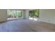 Bright living room with updated flooring and views to the backyard at 8701 Driftwood Drive Dr, Tampa, FL 33615