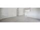 Spacious living room with new gray tiled floors, and fresh white walls offering a modern, clean aesthetic at 8701 Driftwood Drive Dr, Tampa, FL 33615