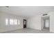 Bright living room with a large window, new flooring, and white walls, perfect for customization at 8701 Driftwood Drive Dr, Tampa, FL 33615