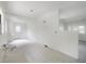 Unfinished living room featuring new floors, white walls, and plumbing fixture set up for renovation at 8701 Driftwood Drive Dr, Tampa, FL 33615