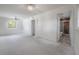 Spacious primary bedroom featuring a ceiling fan, closet, and an en suite bathroom with a tile shower at 8701 Driftwood Drive Dr, Tampa, FL 33615