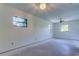 Large main bedroom offering multiple windows and plenty of natural light at 8701 Driftwood Drive Dr, Tampa, FL 33615