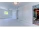 Bright main bedroom with ceiling fan, windows, and access to an attached bathroom at 8701 Driftwood Drive Dr, Tampa, FL 33615