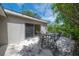 Patio with table, chairs and string lights create a cozy outdoor dining space at 8701 Driftwood Drive Dr, Tampa, FL 33615
