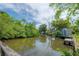 Beautiful waterfront view with docks lining the tranquil waterway, showcasing the boating community at 8701 Driftwood Drive Dr, Tampa, FL 33615