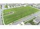 An aerial view of a green space with a playground nestled within a residential community at 9098 Forge Breeze Loop, Wesley Chapel, FL 33545