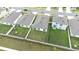 Aerial view of houses surrounded by fenced-in yards, showing a Gathering-friendly neighborhood layout at 9098 Forge Breeze Loop, Wesley Chapel, FL 33545