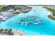 Aerial view of the lagoon featuring a floating water park with slides and plenty of attractions at 9098 Forge Breeze Loop, Wesley Chapel, FL 33545
