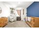 Charming Bedroom with aviation-themed decor and a cozy rocking chair, creating a playful atmosphere at 9098 Forge Breeze Loop, Wesley Chapel, FL 33545