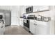 Close-up of the kitchen with stainless steel appliances and granite counters at 9098 Forge Breeze Loop, Wesley Chapel, FL 33545