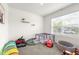Bright playroom with play area and natural light, creating a fun and inviting space for children at 9098 Forge Breeze Loop, Wesley Chapel, FL 33545