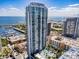 Stunning aerial view of a modern high-rise condo building overlooking the bay and downtown cityscape at 100 1St N Ave # 2304, St Petersburg, FL 33701