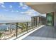 Balcony with glass railings overlooking views of the water, marina, green space, and city at 100 1St N Ave # 2304, St Petersburg, FL 33701