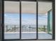 Balcony featuring glass railings and tile floors overlooking views of a marina and harbor at 100 1St N Ave # 2304, St Petersburg, FL 33701