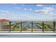 Balcony featuring views of a marina, harbor, green spaces, and clear blue skies at 100 1St N Ave # 2304, St Petersburg, FL 33701